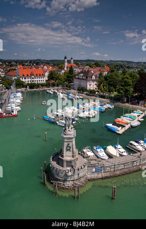 Harbor entrance with the Bavarian lion seen from the lighthouse, harbor and the downtown Lindau, Lake Constance, Bavaria, Germa Stock Photo