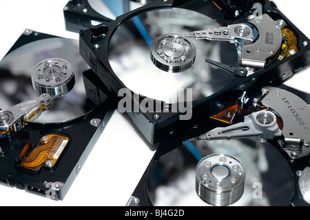 Close-up of a few open HDDs on white background without covers Information storage Data recovery service concept Stock Photo