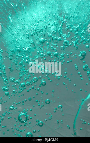 Ice with bubbles of air abstract light green blue macro background texture Stock Photo