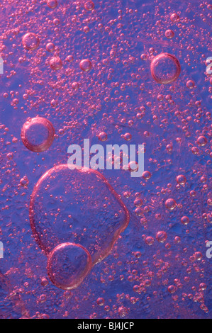 Ice with bubbles of air abstract purple macro background texture Stock Photo