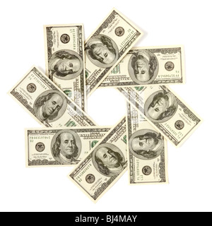 Artistic pattern made from dollar bills Snowflake star or aperture Isolated with a clipping path on white background Stock Photo