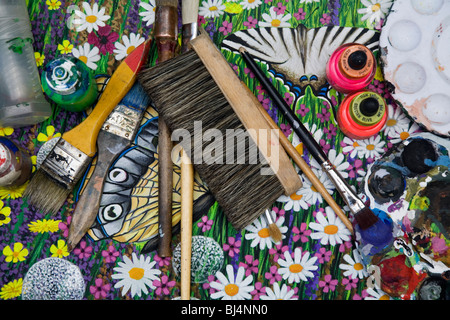 Street artist painter tools. Paintbrushes over a canvas. Munich, Germany Stock Photo