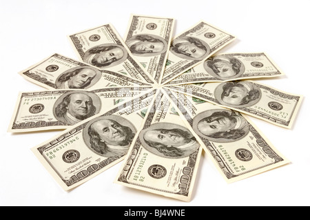 Artistic pattern made from dollar bills Snowflake or star Isolated on white background Stock Photo