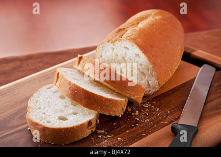 loaf of thick slice Italian bread on a cutting board. closeup horizontal format. Stock Photo