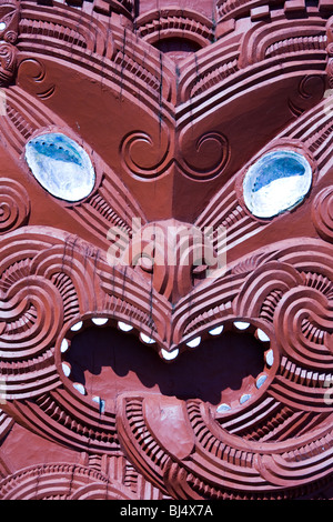 Wood carvings on the facade of Rotowhio Marae  a meeting house at Te Puia a popular Maori cultural center in Rotorua New Zealand Stock Photo