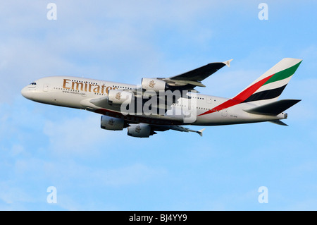 Emirates Airbus A380 climbing out from take off at London Heathrow Airport Stock Photo
