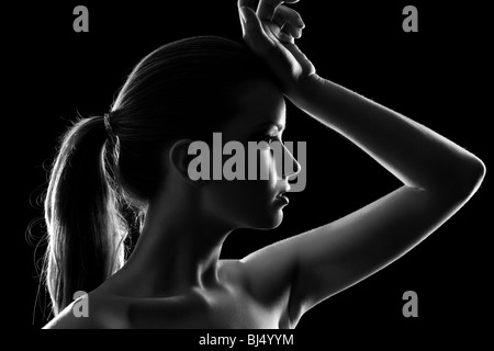 Young woman elegant portrait. Black and white silhouette. Stock Photo