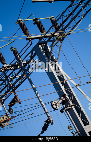 Overhead power lines and gantry for electrified railway Stock Photo