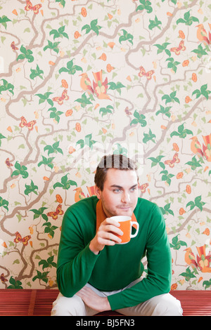 man drinking from cup Stock Photo