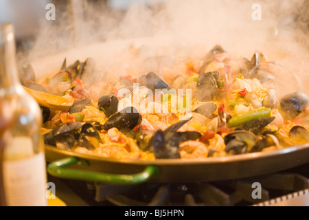 chef Mancuso prepares a traditional Spanish dish of paella at a cooking class at Roblar Winery, Santa Ynez Valley, California Stock Photo