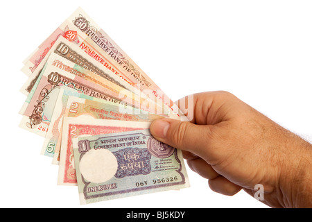 Money male hand holding handful of old Indian currency Stock Photo