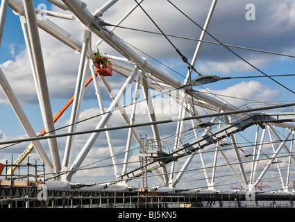 Workers at the Olympic Stadium site in Stratford, London. Stock Photo