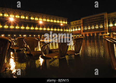 Flooded tables and chairs in St Mark's Square, Venice, Italy Stock Photo