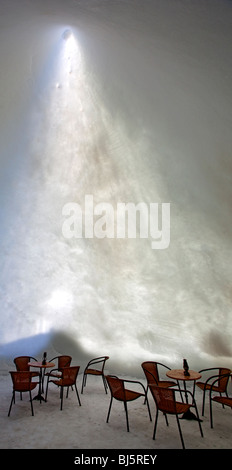 The interior of a snow cafe made of compacted snow and ice in Finland at Winter, sun glowing through thin snow walls , Finland Stock Photo