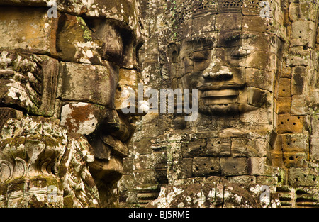 Cambodia, Angkor Thom, Bayon. Massive stone faces watch your every move at Bayon, a well-known and richly decorated Khmer temple Stock Photo