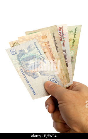 Money male hands holding handful of Egyptian currency Stock Photo