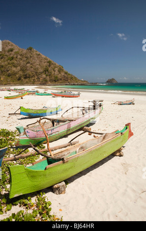 Indonesia, Lombok, South Coast, Seong Blanak, colourfully painted fishing boats on the beach Stock Photo