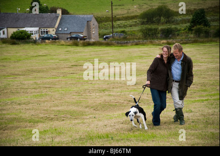 Happy married couple walking and enjoying their country lifestyle, Cumbria, uk Stock Photo