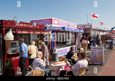 UK, England, Norfolk, Hemsby, Beach Road, customers at fast food outlets on sunny day Stock Photo