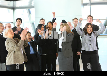 Group of businesspeople cheering and celebrating Stock Photo