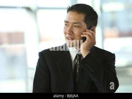 Businessman talking on cell phone Stock Photo