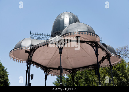 elegant cast iron frame & luminous lacy metal shell against clear blue sky Victorian bandstand in Oaxaca City Mexico Stock Photo