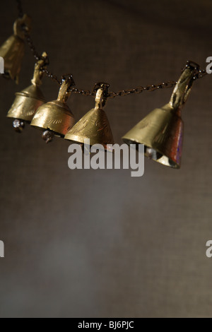 Indian temple bells in a smoky atmosphere. Stock Photo