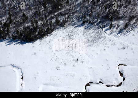 Vermont aerial view of snowy stream in late winter. Stock Photo