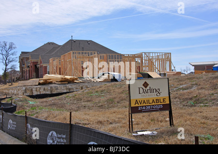 AVAILABLE sign on lot for house to be constructed Stock Photo