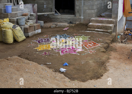 Rangoli festival designs in an Indian street made at the Hindu festival of Sankranthi or Pongal. Stock Photo