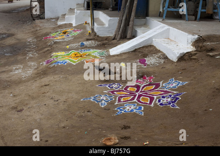 Rangoli festival designs in an Indian street made at the Hindu festival of Sankranthi or Pongal. Stock Photo