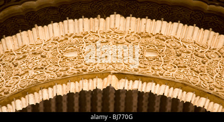 Granada, Andalusia, Spain. Detail of intricately decorated arch in the Patio del Mexuar, the Alhambra. Stock Photo