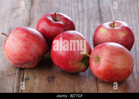 Red apples on a wooden table Stock Photo