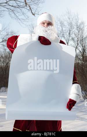 Santa Claus holding copyspace blank sign. Portrait Isolated on White ...