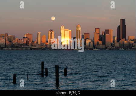 Retro image, Seattle skyline from West Seattle with moonrise over Elliott Bay Washington State USA Stock Photo