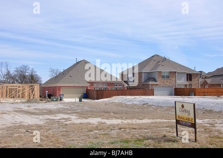 AVAILABLE sign on lot for house to be constructed Stock Photo