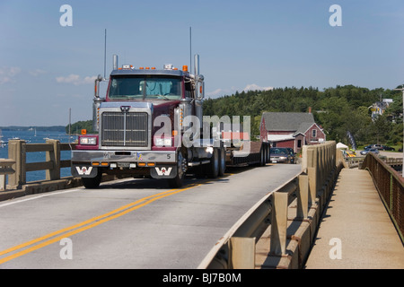 A truck crosses the unique, historic, and narrow Granite Cribwork Bridge onto Bailey Island, Maine Stock Photo