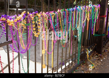 Mardi Gras beads on fence in New Orleans Stock Photo - Alamy