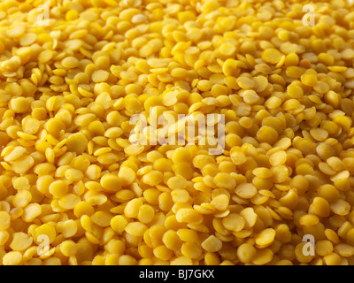 Whole dried yellow lentil beans - close up full frame top shot. Stock Photo