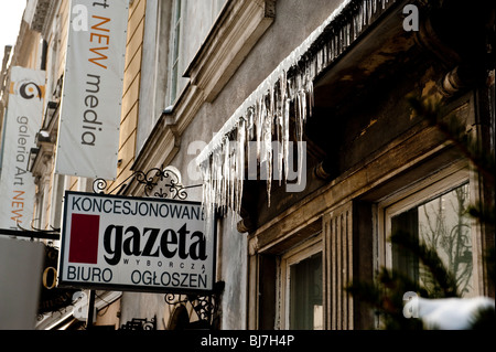 Icicles and melting snow of the roofs along Krakowskie Przedmiecie street in Warsaw Poland Stock Photo