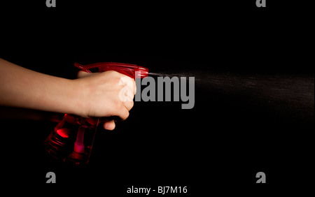 spraying on black background Stock Photo