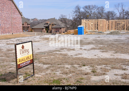 AVAILABLE sign on lot for house to be constructed Stock Photo