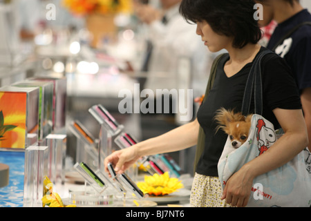 Customers shopping for new mobile telephones in phone store in Tokyo, Japan, 2007. Stock Photo