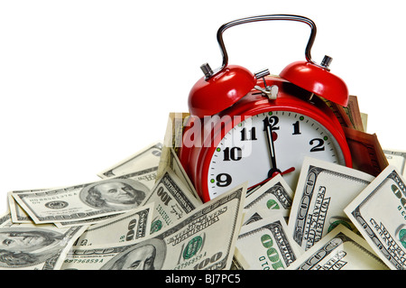 Retro styled alarm clock covered pile of money isolated on white. Time is money concept Stock Photo