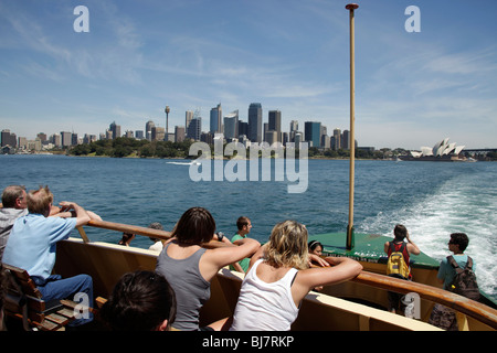 tourists on the Manly Ferry watching the Skyline and Opera in Sydney, New South Wales, Australia Stock Photo