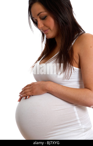 8 month pregnant woman 30 years of age with baby bump Stock Photo