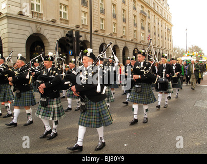 Irish piped band marching through the streets of London during St Patrick Day celebrations Stock Photo