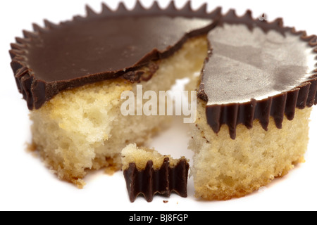 Single dark chocolate topped split cupcake Stock Photo