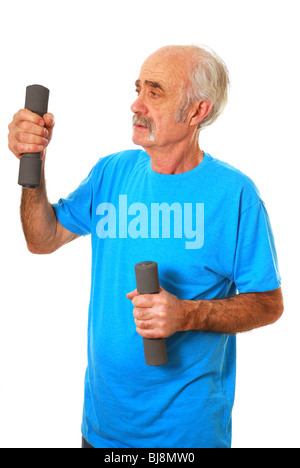 Senior Citizen working out with dumbells Stock Photo