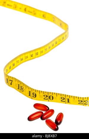 pill and a tape measure Stock Photo